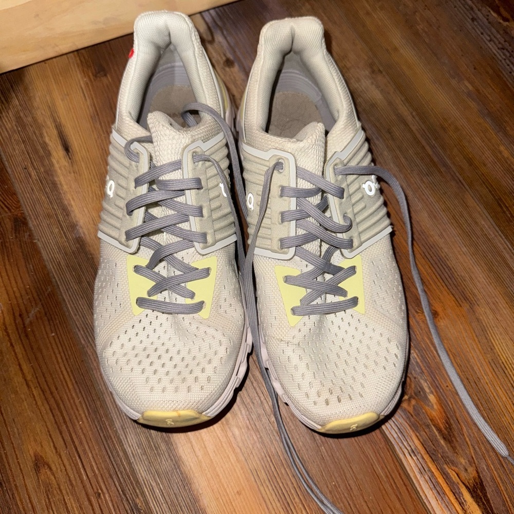 On Running Cream and Gray Sneakers